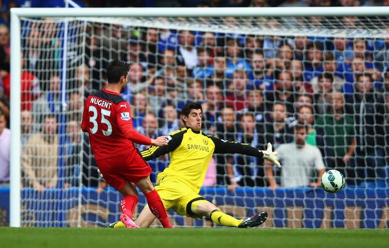 Thibaut Courtois of Chelsea saves from David Nugent of Leicester City during the Barclays Premier League match between Chelsea and Leicester City at Stamford Bridge on August 23, 2014 in London, England. (Photo by Paul Gilham/Getty Images)