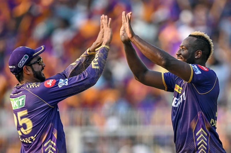 Kolkata Knight Riders' Andre Russell celebrates with his teammate Venkatesh Iyer, left, after taking the wicket of Lucknow Super Giants' captain KL Rahul. AFP