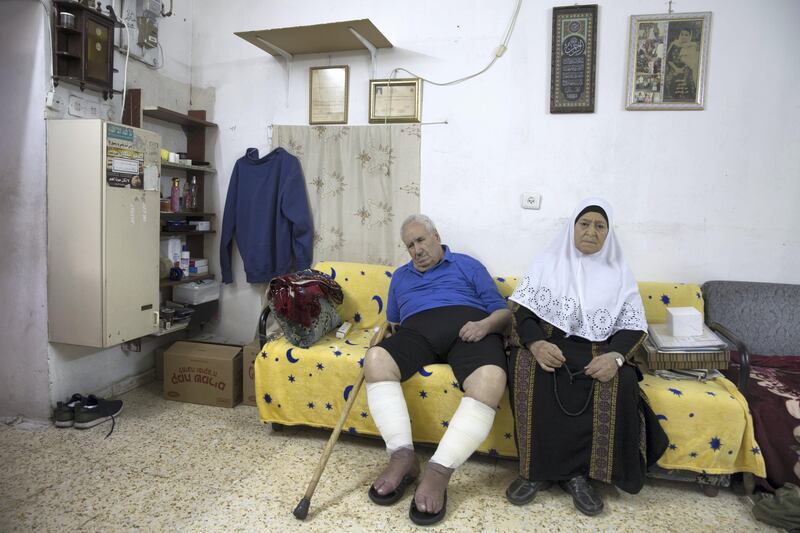  Ayoub and Fahima Shamasneh in their basement home in the East Jerusalem neighborhood of Sheik Jarrah on August 11,2017.

When the Shamasne family first moved into their home  in the 1960s, East Jerusalem was controlled by Jordan and their monthly rent was paid to  Jordanian authorities but since  Israel annexed East Jerusalem in 1967, the Shamasne family has paid their rent to Israel's general custodian in order to remain in the building.
The family claims that their payments were suddenly rejected in 2009 , and they were informed that the property had been claimed by Israeli Jews whose ancestors had lived there decades previously.Although the family has spent years fighting to remain in the home , the Israeli high court has ruled that the family must evacuate the home before August 9. (Photo by Heidi Levine for The National).
