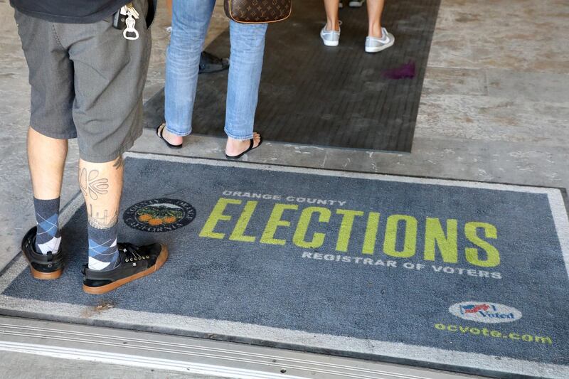 Early voters line up to cast ballots in the 2018 midterm elections at a polling station in Huntington Beach, California. EPA