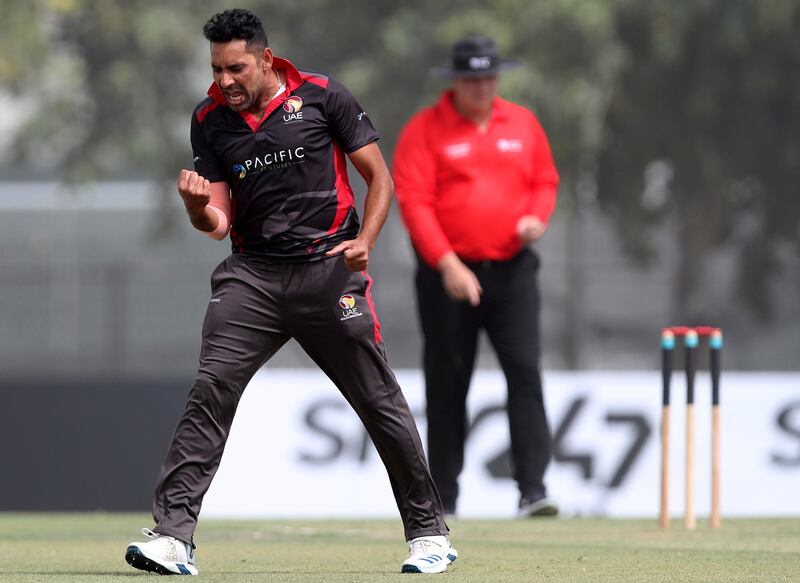 UAE bowler Zahoor Khan celebrates taking the wicket of Namibia's Karl Birkenstock for two.