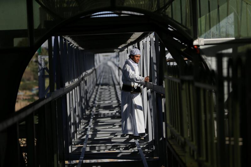 A man stands in an amusement park suspension railway dubbed "Train of Return" in the southern Gaza Strip. Reuters
