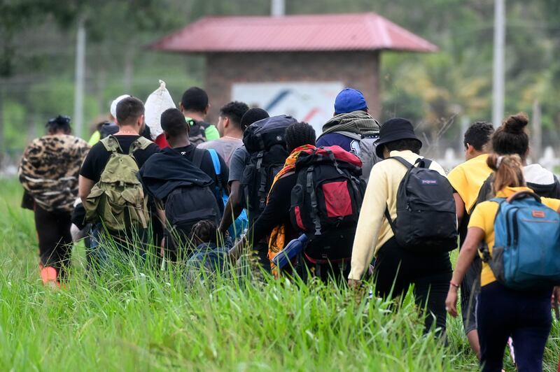 Migrants heading to the US enter Honduras from Nicaragua. AFP