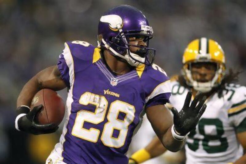 Minnesota Vikings running back Adrian Peterson, left, ended the NFL season on a tear and will be up for consideration for the MVP award.