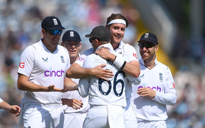 England bowler Stuart Broad celebrates with Joe Root after the pair combine to dismiss Tom Latham. Getty