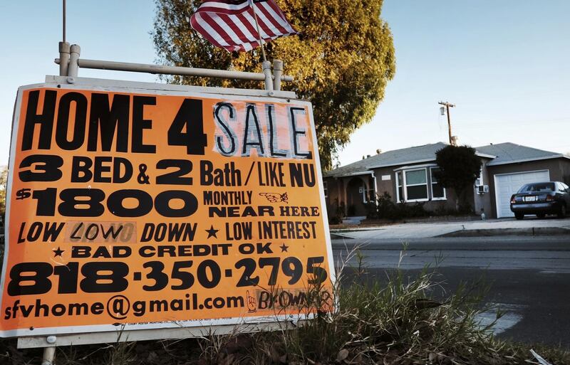 FILE - This Jan. 17, 2015 photo shows a sign advertising a house for sale in Los Angeles. Analysis by Reveal from The Center for Investigative Reporting found Latinos accounted for nearly half of the population in the Los Angeles area in 2015-2016, yet made up just 18 percent of conventional loan applications. (AP Photo/Richard Vogel, File)