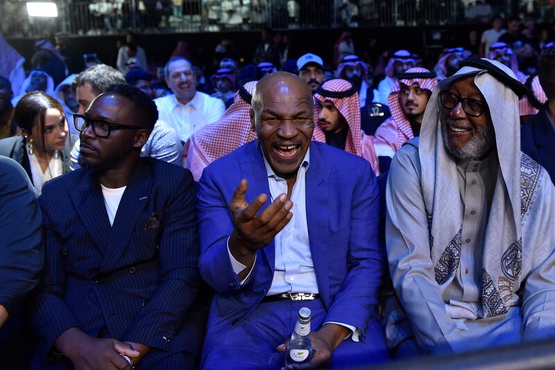 Former heavyweight champion Mike Tyson, centre, was in attendance. PA