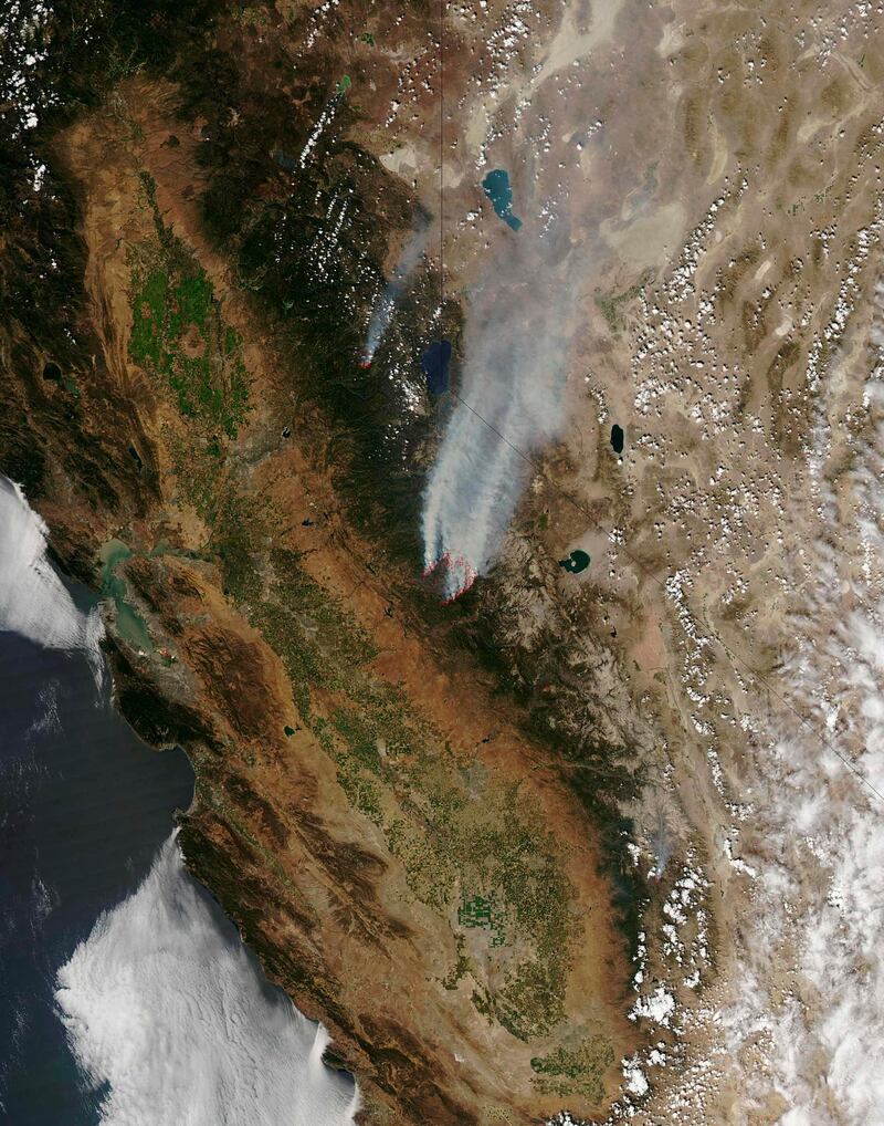 The Moderate Resolution Imaging Spectroradiometer (MODIS) on NASA's Aqua satellite captured this image of the Rim fire burning in and near Yosemite National Park in California on August 26, 2013. Red outlines indicate hot spots where MODIS detected unusually warm surface temperatures associated with fire. Picture taken August 26, 2013. REUTERS/Jeff Schmaltz, LANCE/EOSDIS Rapid Response/NASA/Handout via Reuters  (OUTER SPACE - Tags: DISASTER ENVIRONMENT) FOR EDITORIAL USE ONLY. NOT FOR SALE FOR MARKETING OR ADVERTISING CAMPAIGNS. THIS IMAGE HAS BEEN SUPPLIED BY A THIRD PARTY. IT IS DISTRIBUTED, EXACTLY AS RECEIVED BY REUTERS, AS A SERVICE TO CLIENTS *** Local Caption ***  TOR353_USA-FIRE-YOS_0828_11.JPG