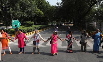 epa07087901 Indian activists from All India Democratic Women's Association makes a human chain during a protest against incidents of sexual assault and harassment at work place, in New Delhi, India, 12 October 2018. According to reports, Bollywood actress Tanushree Dutta filed complaint of sexual harassment against actor Nana Patekar. Indian activists from All India Democratic Women's Association show their support #MeToo movement where women sharing incidents of sexual assault and harassment.  EPA/RAJAT GUPTA