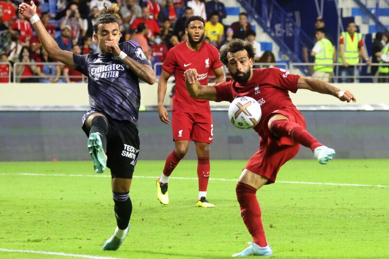 Lyon defender Malo Gusto attempts to block Liverpool striker Mohamed Salah during their Dubai Super Cup clash at Al Maktoum Stadium on December 11, 2022. AFP