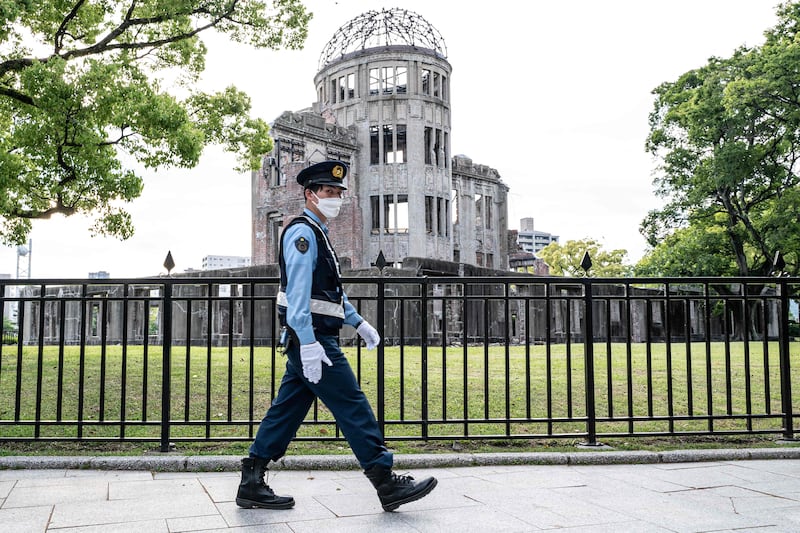 A policeman patrols past the Atomic Bomb Dome in Hiroshima just days ahead of the arrival of leaders for the G7 Leaders' Summit. AFP