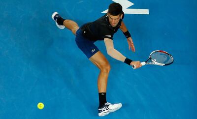 MELBOURNE, AUSTRALIA - JANUARY 20:  Novak Djokovic of Serbia stretches for the ball during his third round match against Albert Ramos-Vinolas of Spain on day six of the 2018 Australian Open at Melbourne Park on January 20, 2018 in Melbourne, Australia.  (Photo by Scott Barbour/Getty Images)
