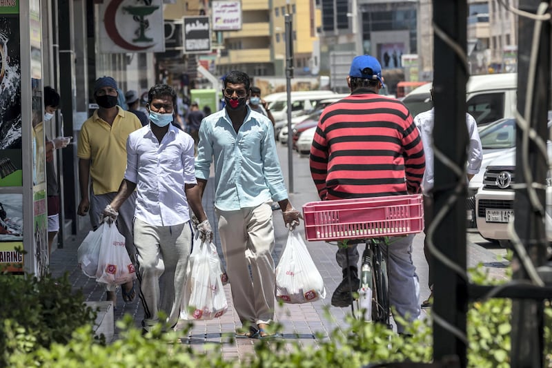 DUBAI, UNITED ARAB EMIRATES. 08 MAY 2020. STANDALONE. People move about in Satwa while the COVID-19 Stay at home measures are in place in the UAE (Photo: Antonie Robertson/The National) Journalist: None Section: National.