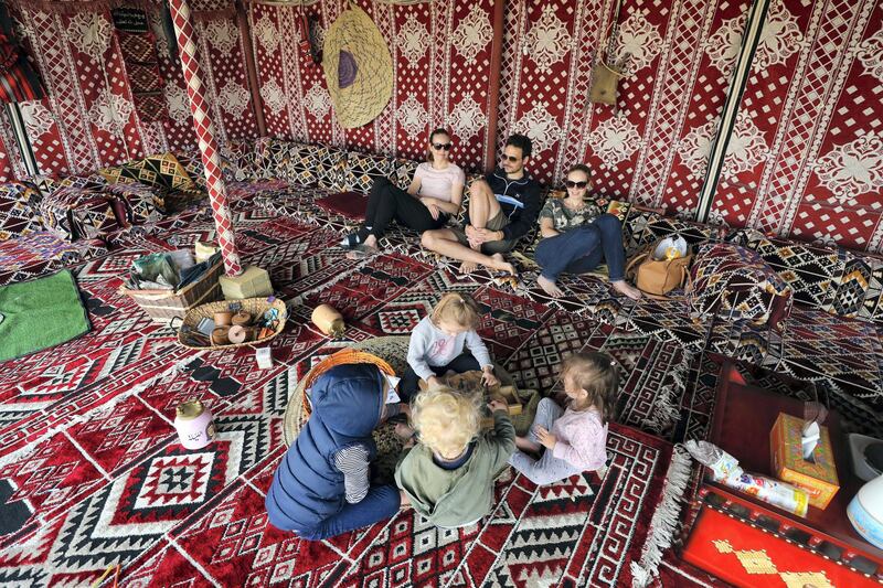 Dubai, United Arab Emirates - January 19, 2019: Kids play inside a tent. Images of a new tourist attraction in Dubai called The Camel Farm. Saturday, January 19th, 2019. E77, Dubai. Chris Whiteoak/The National