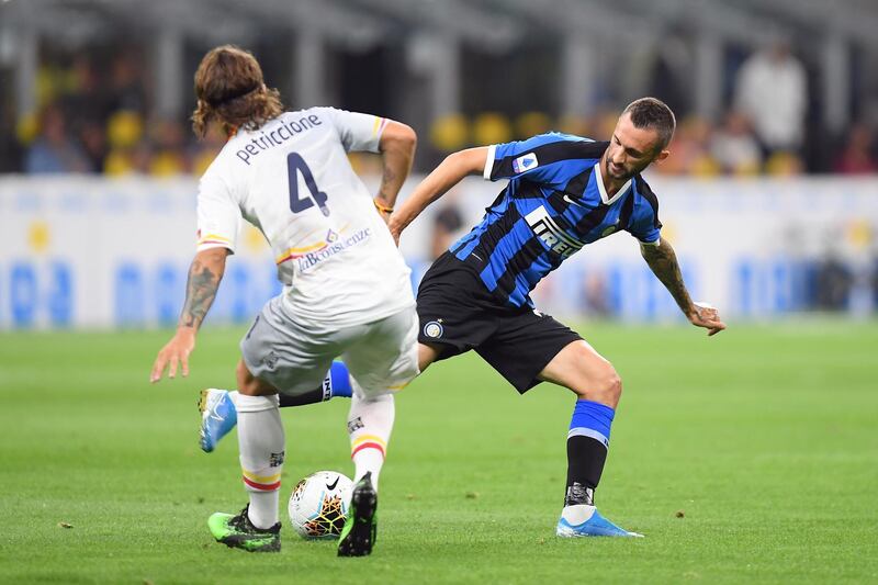 Inter Milan's Marcelo Brozovic in action with Lecce's Jacopo Petriccione. Reuters