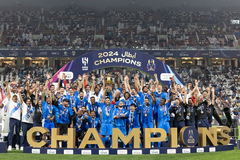 Al Hilal players celebrate their Saudi Super Cup victory over Al Ittihad in Abu Dhabi. Goals from Brazilian forward Malcolm (2), Salem Al Dawsari and namesake Nasser Al Dawsari sealed a 4-1 victory at the Mohamed bin Zayed Stadium in Abu Dhabi as Hilal claimed the trophy and extended their world record run of wins to 34 matches. AFP