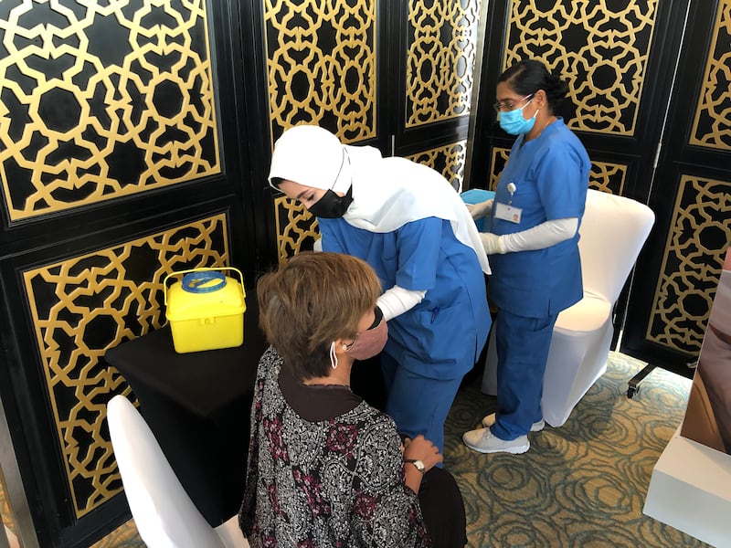 People obtain flu vaccine shots in Dubai.