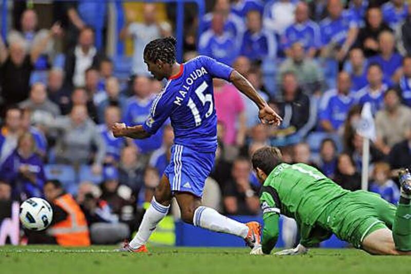 Florent Malouda scores Chelsea's sixth goal past West Bromwich Albion goalkeeper Scott Carson at Stamford Bridge yesterday.