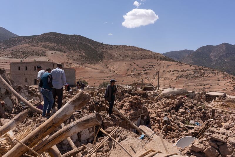 Villagers survey the rubble of destroyed buildings after the earthquake near Amizmiz. Bloomberg