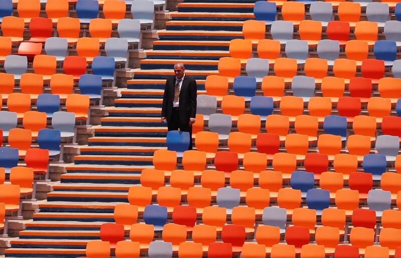 A security employee looks on inside the Cairo International Stadium ahead of the Africa Cup of Nations opening soccer match between Egypt and Zimbabwe in Cairo, Egypt.  Reuters