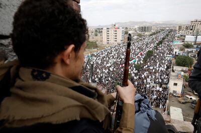 epa09183955 An armed Houthi fighter keeps watch as Houthi supporters attend a rally marking the Al-Quds Day (Jerusalem Day) on the last Friday of the Muslim fasting month of Ramadan in Sana'a, Yemen, 07 May 2021. Thousands of pro-Houthis Yemenis took to a street in Sanaâ€™a to mark the Al-Quds Day (Jerusalem Day) on the last Friday of Ramadan, highlighting the plight of the Palestinian people. The Al-Quds Day is an annual day of protest, decreed in 1979 by the late Iranian ruler Ayatollah Khomeini, to demand the end of Israeli occupation of Jerusalem and for the establishment of an independent state of Palestine.  EPA/YAHYA ARHAB