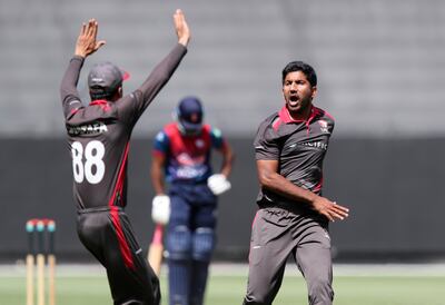 UAE's Junaid Siddique celebrates the wicket of Nepal's Aasif Sheikh. Chris Whiteoak / The National