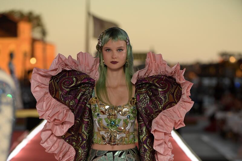 A model presents a look from Dolce & Gabbana's Alta Moda collection in Venice, Italy.