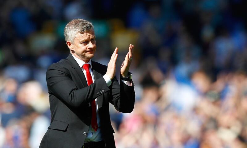 Manchester United manager Ole Gunnar Solskjaer applauds after the final whistle in the English Premier League soccer match against Everton at Goodison Park, Liverpool, England, Sunday April 21, 2019. (Martin Rickett/PA via AP)