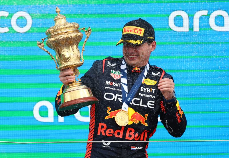 Red Bull's Max Verstappen celebrates with the trophy after winning the British Grand Prix at Silverstone on Sunday, July 9, 2023. Reuters
