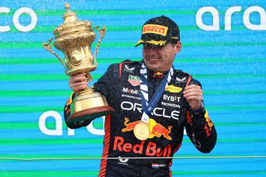 Formula One F1 - British Grand Prix - Silverstone Circuit, Silverstone, Britain - July 9, 2023 Red Bull's Max Verstappen celebrates with a trophy on the podium after winning the race REUTERS / Molly Darlington