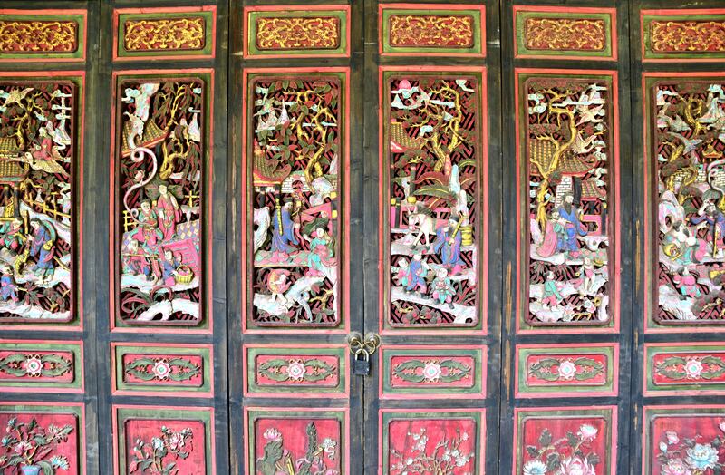 Delicately carved wood panels at the entrance to an Anren mansion 