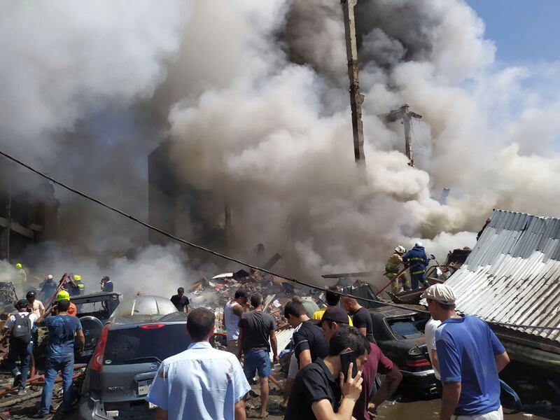 Smoke rises from a market in Armenia's capital Yerevan after explosions at a warehouse containing fireworks.  AP