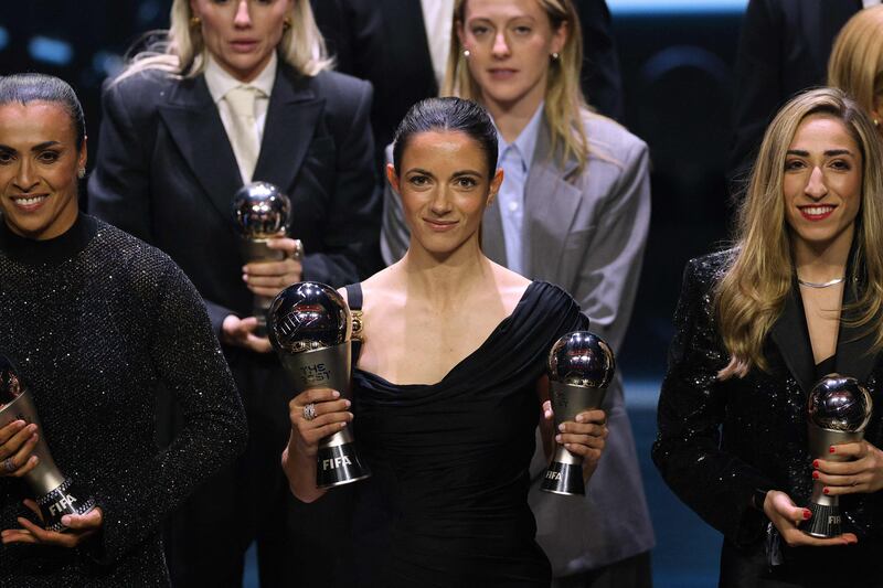 Spain and Barcelona midfielder Aitana Bonmati poses with her awards as she was also named in the Best XI women's team. AP