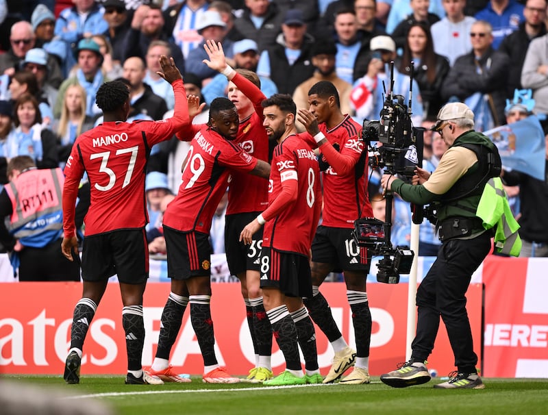 Scott McTominay celebrates with teammates after scoring for Manchester United. Getty Images