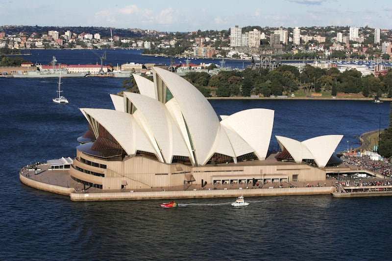 SYDNEY, AUSTRALIA - JULY 18:  The Cross is transported to the Opera House by boat along Sydney Harbour with thousands of fans gathering along the shores to catch a glimpse. Actors including Alfio Stuto (Jesus) and Marina Dixon (Mary) re-enact scenes including Jesus before Pilate, Jesus being scourged and crowned with thorns and Jesus taking up His cross at Location 4 of 'Stations of the Cross', a travelling dramatised re-enactment of the last days of Jesus' life acted across seven CBD locations, at Sydney Opera House on July 18, 2008 in Sydney, Australia. Organised every two to three years by the Catholic Church, World Youth Day (WYD) is an invitation from the Pope to the youth of the world to celebrate their faith. The celebration, being held in Sydney from July 15 to July 20, 2008, will mark the first visit of His Holiness Pope Benedict XVI to Australia.  (Photo by Gaye Gerard/Getty Images)