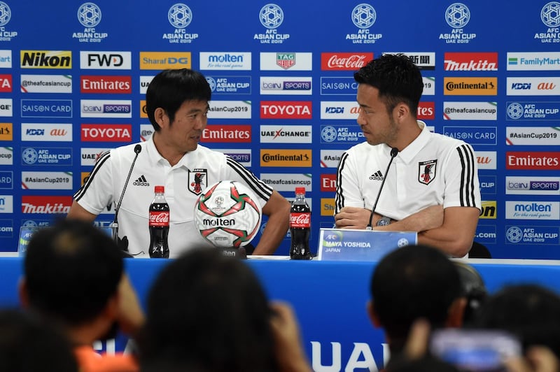 Japan's player Maya Yoshida, right, with head coach Hajime Moriyasu, left, attend the pre-match press conference ahead of the AFC Asian Cup final match against Qatar at the Zayed Sports City Stadium in Abu Dhabi.  AFP