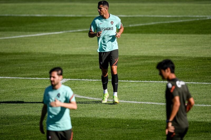 Portugal forward Cristiano Ronaldo with teammates at Cidade do Futebol training camp. AFP