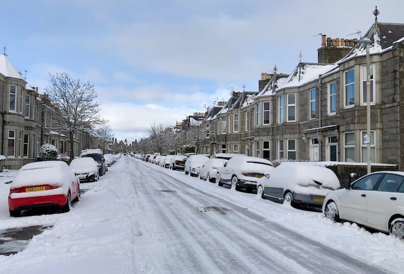 A street blanketed with snow in the west end of Aberdeen, Scotland. PA