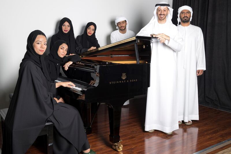 Fatima Alhashmi, Eman Dohai, Mariam Alshami, Bushra Dohai, Ahmed Alnuami, Hamed Altaee and Mohamed Aljahoori are the featured artists in ‘Seven Emirati Pianists, One Composer’. Courtesy Pictures DCC