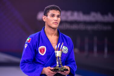 Meyran Alves, blue, takes the gold against Isaac Doederlien of the USA in the Abu Dhabi King of the Mats 2022 Finals, Abu Dhabi Grand Slam World Tour Final Round Day- 2 at Zayed Sports City’s Jiu-Jitsu Arena in Abu Dhabi. Victor Besa / The National