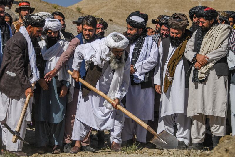 A new Taliban programme is offering what for work to combat hunger in Afghanistan. AFP