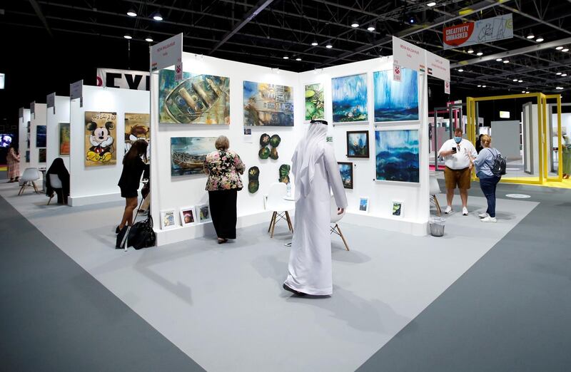 Visitors gather at the Dubai World Trade Centre. EPA