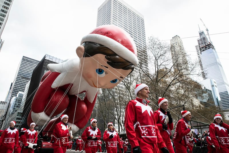 A giant Elf on the Shelf balloon makes its way down Sixth Avenue in New York.  AP