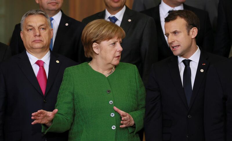 Hungarian Prime Minister Viktor Orban, German Chancellor Angela Merkel and French President Emmanuel Macron take part in a group photo during a High Level Conference on the Sahel in Brussels, Belgium February 23, 2018.   REUTERS/Olivier Hoslet/Pool     TPX IMAGES OF THE DAY