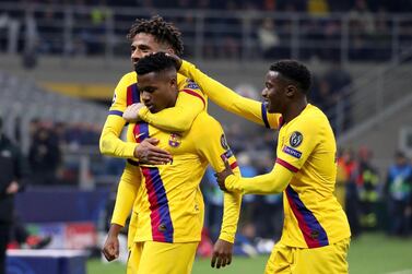 Barcelona's Ansu Fati (C) celebrates with teammates Jean-Clair Todibo and Moussa Wague after scoring the winner  in Milan. EPA