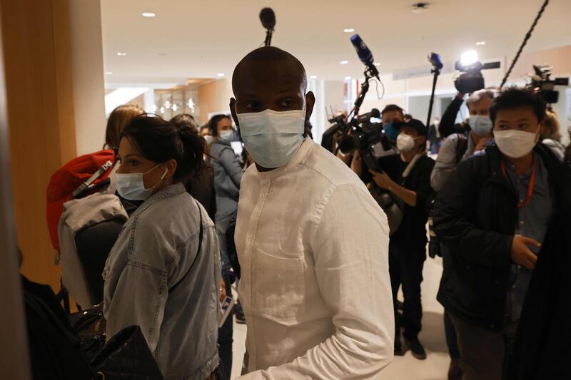Lassana Bathily, the employee of the Hyper Cacher supermarket who helped shoppers to hide in a cold storage room from a gunman arrives at Paris' courthouse, for the opening hearing of the trial of 14 suspected accomplices in Charlie Hebdo and Hyper cacher jihadist killings. AFP