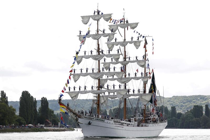 Sailors stand on the masts of Mexico's naval training ship ARM Cuauhtemoc as the ship sails down the Seine River during the Big Parade from Rouen to the sea as part of the 7th Armada at La Bouille, France.  Reuters