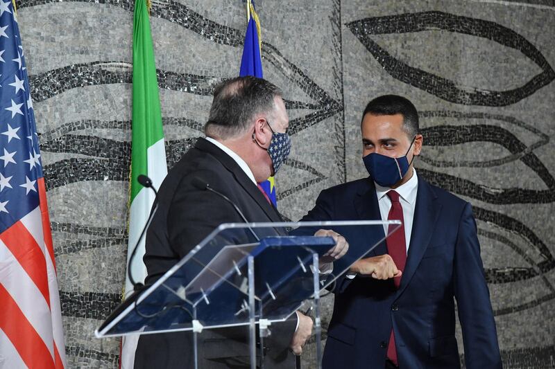 epa08708615 Italian Foreign Minister Luigi Di Maio (R) greets US Secretary of State Mike Pompeo (L) during a press conference at Farnesina Palace in Rome, Italy, 30 September 2020.  EPA/ALESSANDRO DI MEO