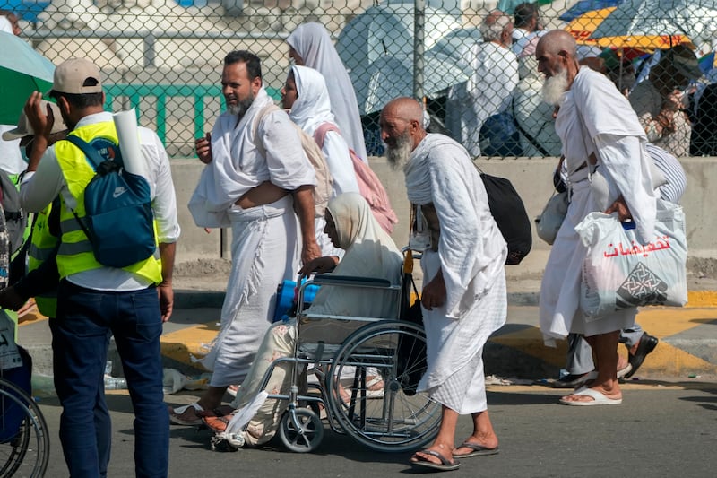 Hajj pilgrims outside a tent camp near Makkah. AP
