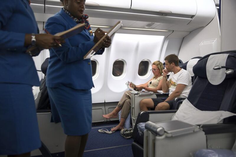 A member of Air Seychelles’ staff works onboard one of the airline’s business class flights from Victoria to Abu Dhabi. Etihad Airways signed a deal with the Seychelles government in January 2012, acquiring a 40 per cent stake in Air Seychelles. Silvia Razgova / The National